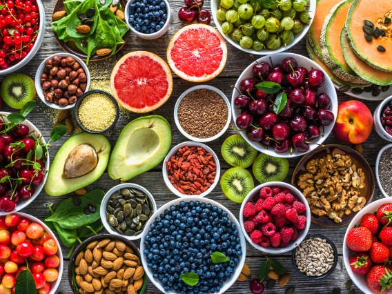 bowls of fruits, vegetables, and nuts