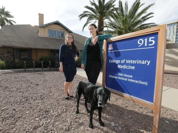 photo of vet students and dog outside