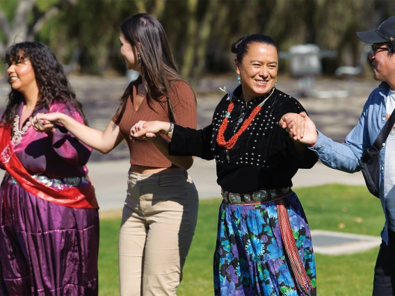 Alumni, students, faculty and staff joined in a Round Dance at the college’s Indigenous Health: Connecting with Wellbeing and Community Day in February 2023