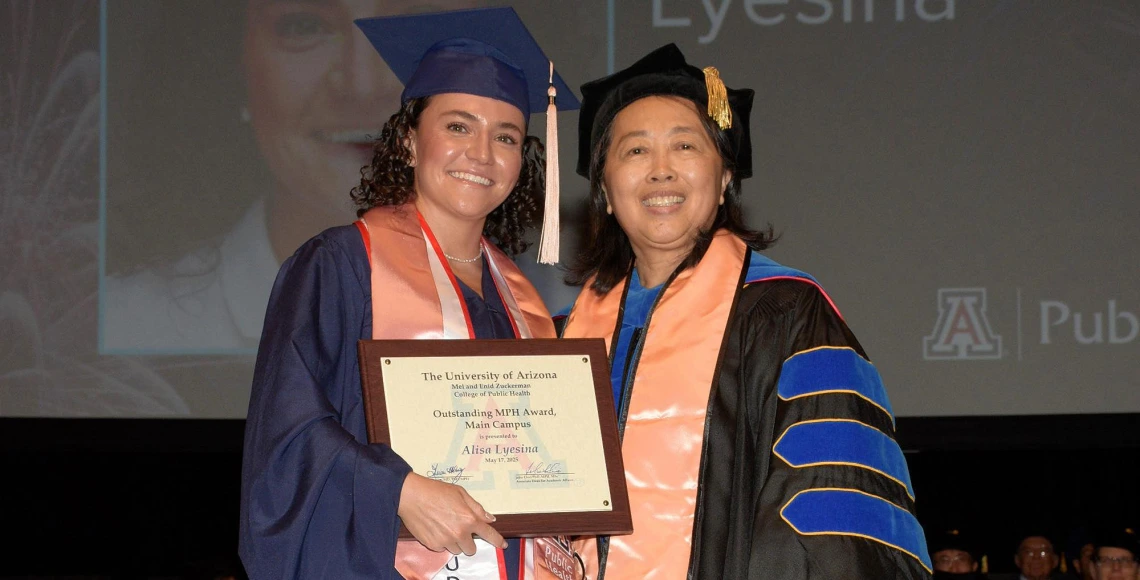 MPH graduate Alisa Lyesina receiving her student award from Dr. Chen