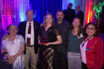 Dr. Mary Foote with her family and Dean Iman Hakim