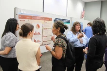 Students share their posters with viewers at the 2025 Public Health Poster Forum