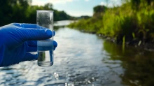 River water sample, environmental testing, nature background, pollution monitoring