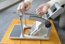 Jonathan Lee-Confer, PhD, uses a tribometer to simulate the motion of a heel strike for slip resistance testing on a floor surface.