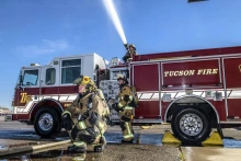 firefighters with Tucson Fire truck