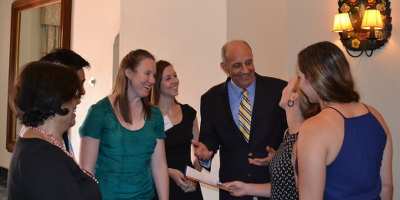 Dr. Carmona conversing with students at the 2015 Partners in Public Health luncheon.