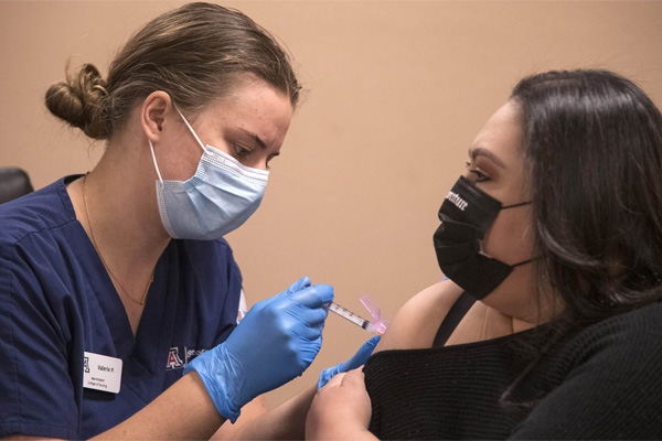 Nurse giving COVID vaccine