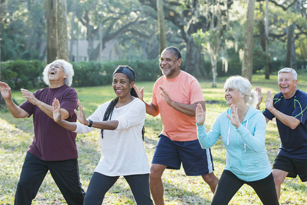 Older people outside exercising