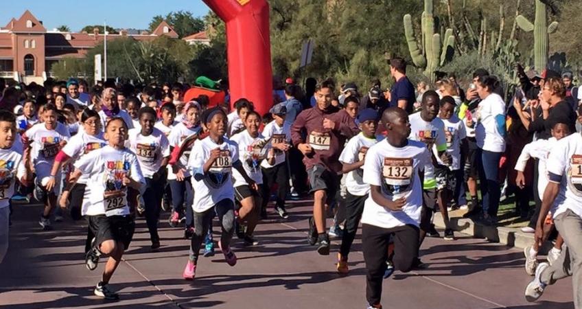 children and families start the race at the Fifth Annual Tucson Marathon Family Fitness Festival on December 3, 2016