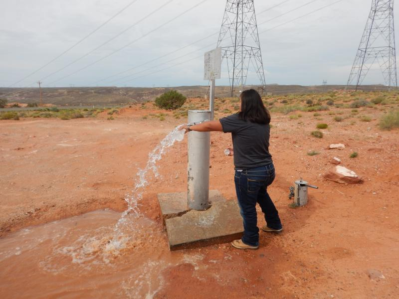 NAU graduate student Andee Lister collects a water sample from an unregulated well in the southwestern region of the Navajo Nation.
