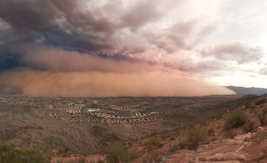 A haboob, or dust storm, blowing into Ahwatukee, near Phoenix, as seen from the top of South Mountain, looking south on July 23, 2011. Notice the size of homes in the foreground.