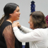 Public Health 1st Generation student being pinned by faculty member